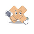 © kongvector - A dedicated cross bandage doctor caricature design working with tools
