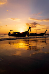 Poster - Traditional long-tail boat on the beach in Thailand at sunset