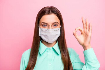 Poster - Close-up portrait of her she nice attractive pretty healthy straight-haired girl wearing safety mask showing ok-sign health care infection influenza recovery isolated pink color background