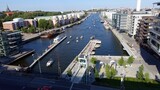 Fototapeta Londyn - Stockholm, Sweden, june 27 2020. A glimpse of the modern district near the water