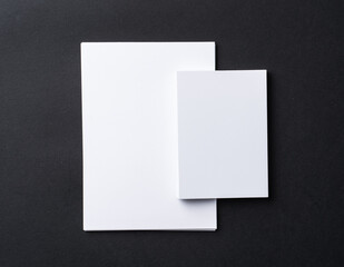 Poster - White blank business cards on dark black background