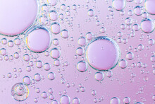 Bubbles Chemical Liquid Pink Macro. Chemical Reaction In Living Organisms Harmful To Helium And Methane In Liquid States