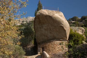 Sticker - traditional anti pirate stone house with giant boulder rock roof on the Greek Island of Ikaria