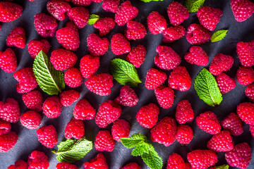 Fresh organic raspberries. background with many berries raspberry top view