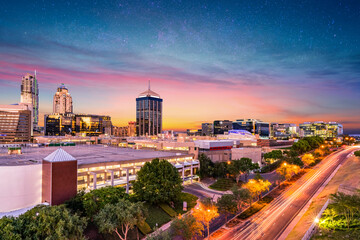 Wall Mural - Sandton City at night with city lights and stars in the sky