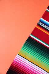 Wall Mural - poncho Mexican cinco de mayo rug serape fiesta traditional Mexico background with poncho stripes copy space maya blanket minimal simple -  stock, photo, photograph, image, picture 