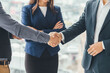 © Andrii - Cropped picture of delighted business people shaking hands making a profitable deal.