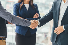 Cropped Picture Of Delighted Business People Shaking Hands Making A Profitable Deal.