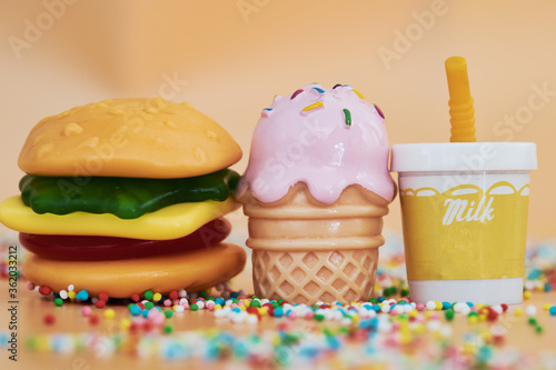 Delicious Mini Gummi Burger Isolated On Oramge Background Candy Version Of Classic American Foods Hamburger Burger Ice Cream And Milkshake Background Party Food Fast Food Copy Space Buy This Stock