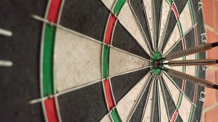 Wall Mural - Three darts in a bull's eye.
