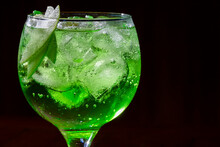 Gin And Green Apple Cocktail On Wood Background