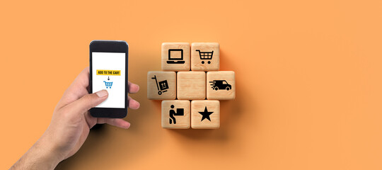 Wall Mural - smartphone with message ADD TO CART and cubes with shopping icons on orange background