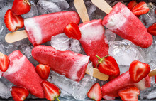 Strawberry yogurt homemade ice lollies close up view. Delicious summer dessert