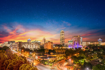 sandton city at night with twilight and stars in the sky