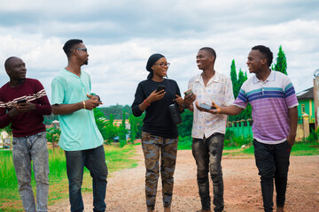 young black friends taking a stroll and checking out things on their smartphones