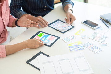 graphic designers team work together with ux ui designer planning application template layout mobile