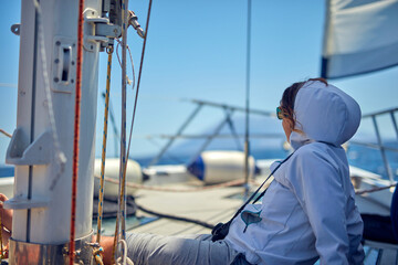 Wall Mural - Summertime cruising enjoying on a sailing boat at open sea.