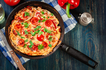 Wall Mural - Frittata made of eggs, sausage chorizo, red pepper, green pepper