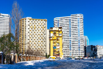 Batumi, Adjara, Georgia - 14.03.2020: soviet-style house residence in the winter with snow in Batumi boulevard, Georgia