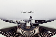 The Word Ghost Writer Typed On The Paper With A Vintage Typewriter