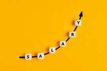 Salary Raise Or Wage Increase Concept With The Word Salary Written On Wooden Blocks