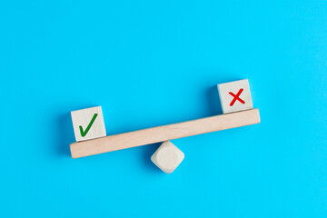 Wall Mural - concept of positive evaluation in decision making, approval or voting. tick mark outweighs cross mar