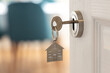 © dechevm - Open door to a new home. Door handle with key and home shaped keychain. Mortgage, investment, real estate, property and new home concept