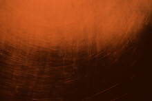 Metallic Grungy Orange Background With Spotlight