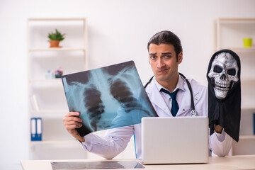 Male devil doctor radiologist working in the clinic