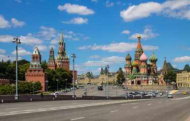 Panoramic view of Red square in Moscow with St. Basil's Cathedral and the Kremlin on a clear summer day against a blue sky and space to copy