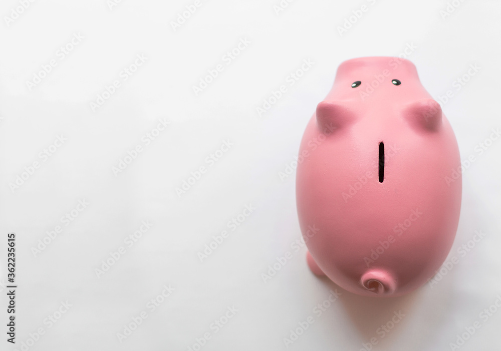 High angle view of a piggy bank isolated on white - obrazy, fototapety, plakaty 