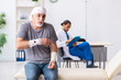 © Elnur - Young male doctor and old patient in first aid concept