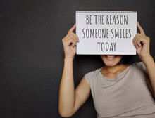 BE THE REASON SOMEONE SMILES TODAY Text Written On Paper. Stock Photo.