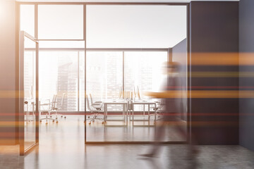 Wall Mural - Man walking in grey open space office