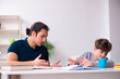 © Elnur - Father and son in exam preparation concept