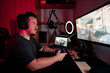 © alvaro - a gamer playing and streaming live with microphones and cameras