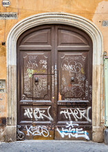 Old Wooden Front Door In Rome Italy Weathered Stone Building Latin Style Character Age Decay History Entrance  Authentic Rustic Italian Roman Porta Graffiti 