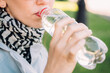 © gesrey - Caucasian girl drinks water from plastic water.