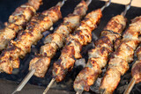Fototapeta  - Grilled Kebab From Meat On Skewer Outdoors.