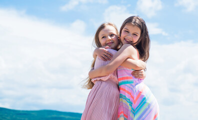 small girls embrace. love and support. concept of sisterhood and friendship. family bonding time. be