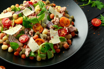 Wall Mural - Mini potato gnocchi tricolour with tomato, spinach, Seasonal salad leaves and parmesan cheese