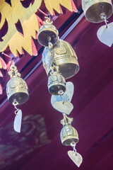 Wall Mural - Golden bells hanging on the Buddhist temple at Wat Phra That Doi Suthep, the famous temple and became the landmark of Chiang Mai, Thailand.