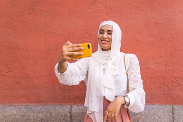 Beautiful Arab Girl Taking Selfie Outdoors. Lifestyle Concept.