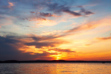 Fototapete - Summer. Picturesque landscape. Beautiful red sunset above lake. Dark clouds close up sunset. 