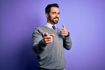 Poster - Handsome businessman with beard wearing casual tie standing over purple background pointing fingers to camera with happy and funny face. Good energy and vibes.