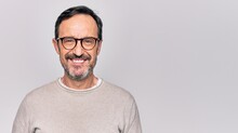 Middle Age Handsome Man Wearing Casual Sweater And Glasses Over Isolated White Background With A Happy And Cool Smile On Face. Lucky Person.