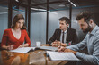 © zinkevych - Couple reading legal papers in a lawyers office