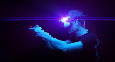 Wall Mural - man with virtual reality headset is playing game. image with glitch effect.