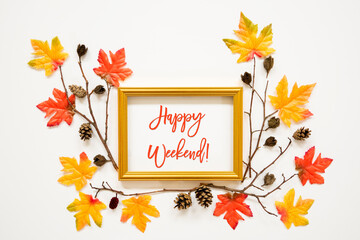Wall Mural - golden frame with english text happy weekend. beautiful, colorful autumn leaf decoration with maple 