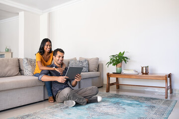 Middle eastern couple using digital tablet